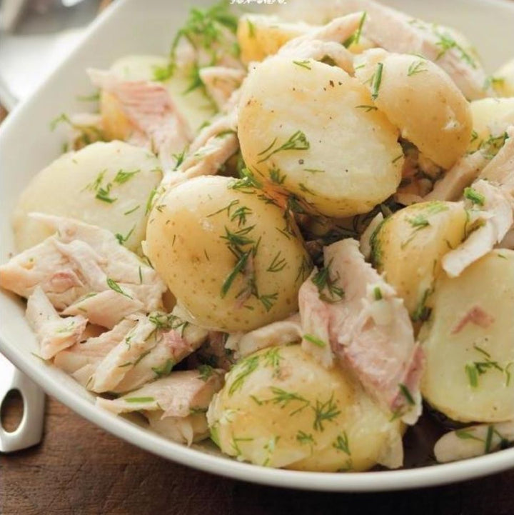 Close up image of Womersley Foods recipe card with image of warm potato salad with smoked trout and chives using Womersley Foods Lime, Black Pepper and Lavender Fruit Vinegar.