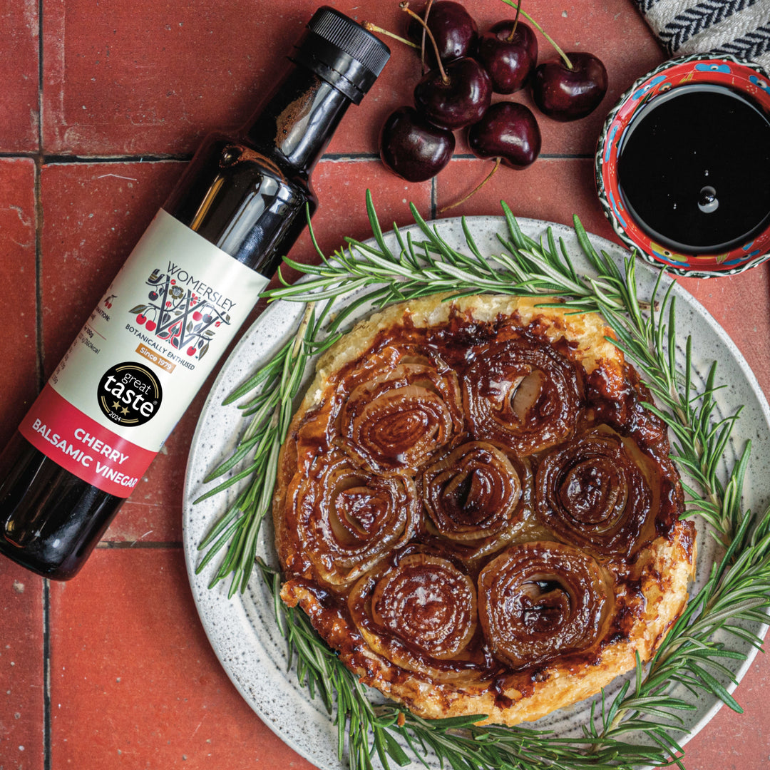 Image of Balsamic Onion Tarte Tatin with a bottle of Womersley Foods Balsamic Vinegar.