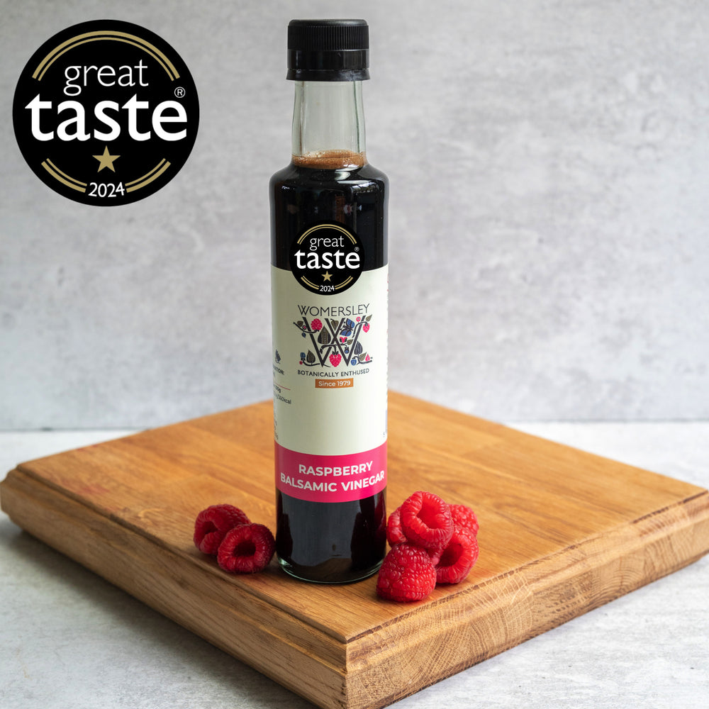 Womersley Raspberry Balsamic Vinegar of Modena 250ml bottle with Great Taste 2024 Award badge and fresh raspberries